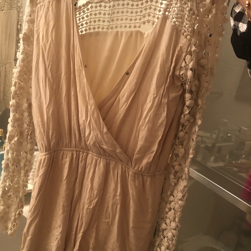 Cream colored romper with floral long sleeves